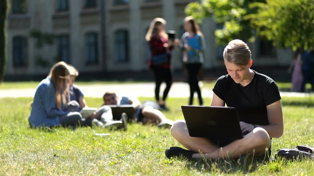 Free Stock Video Young Students Hanging Out On A Campus Meadow Live Wallpaper - Free Download