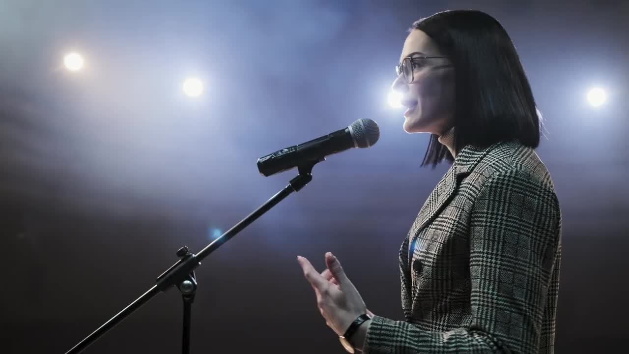 Stock Video Female Speaker Giving A Talk On Stage Live Wallpaper For PC - Free Download