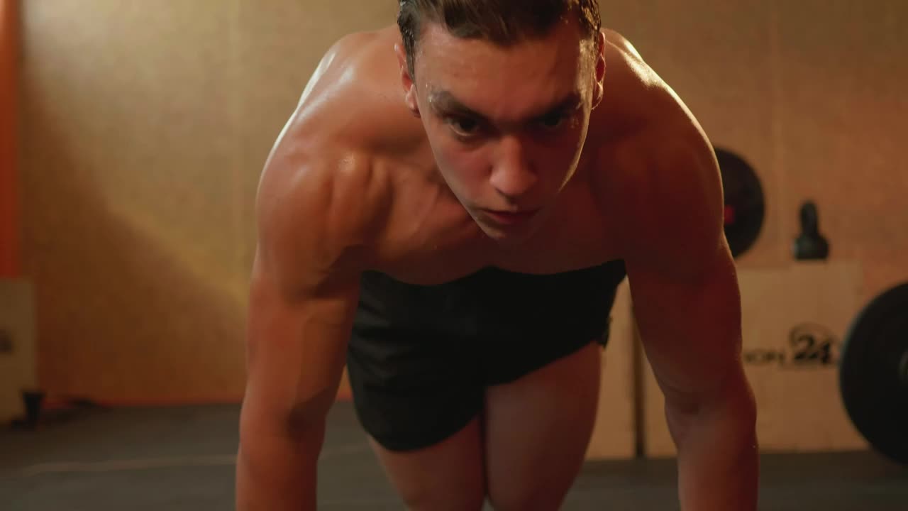 Stock Video Man Doing Strenuous Exercise In A Gym Animated Wallpaper - Free Download