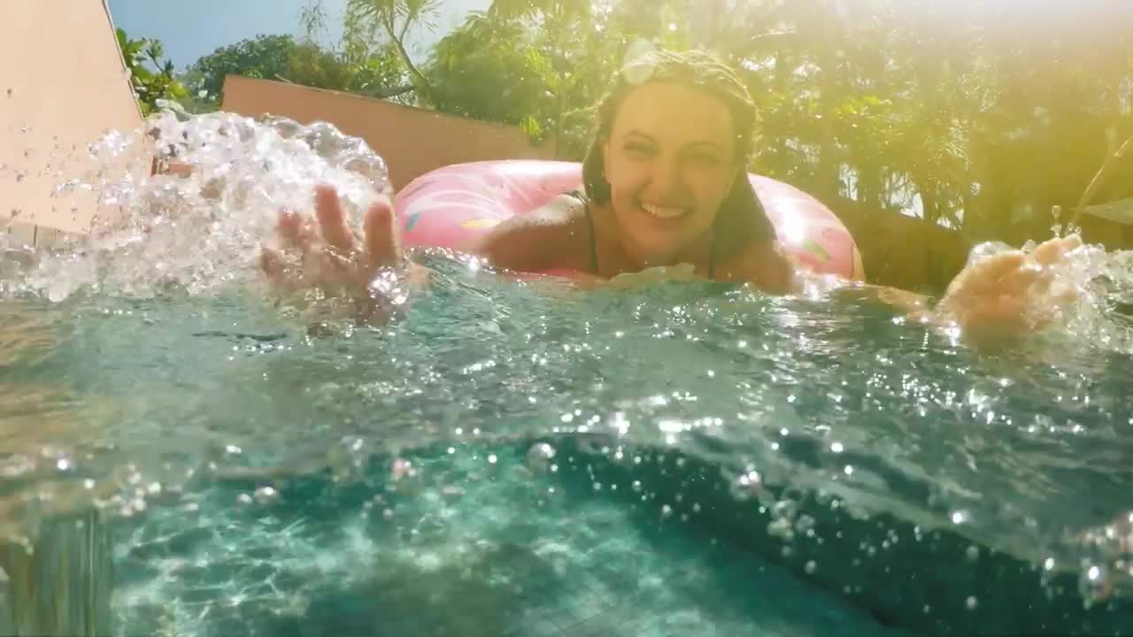 Stock Video Happy Woman Playing With Water In A Swimming Pool Animated Wallpaper - Free Download