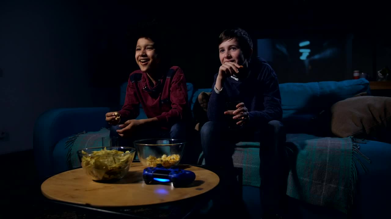 Free Video Stock teens watching a funny film together Live Wallpaper - Free Download