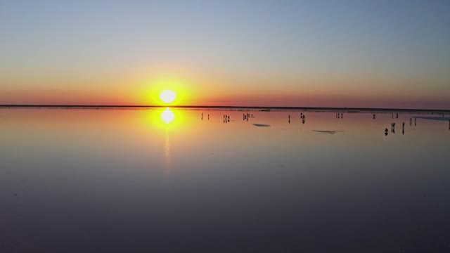 Free Video Stock sunset reflected in a large lake Live Wallpaper - Free Download