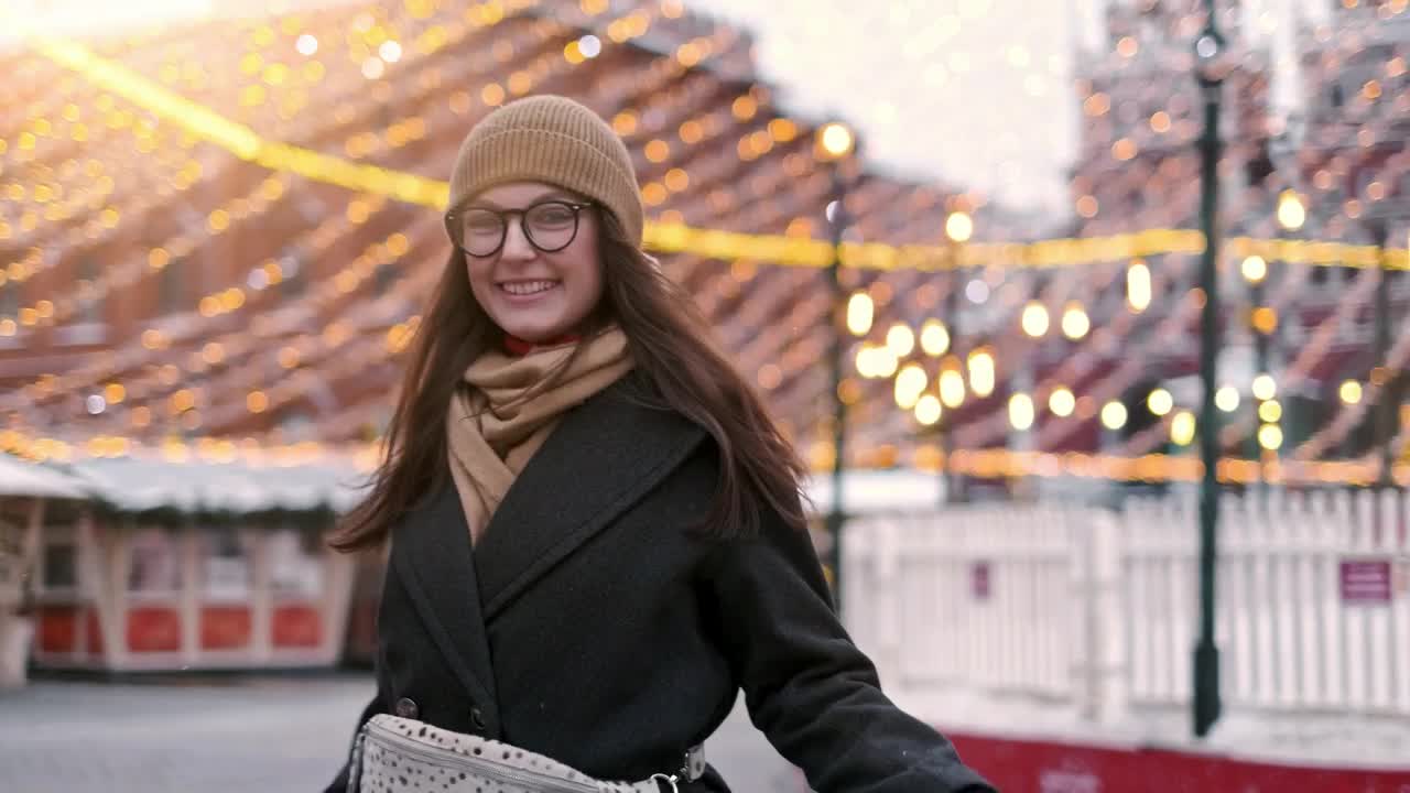 Stock Video Happy Woman Stands On The City Downtown At Christmas Animated Wallpaper - Free Download