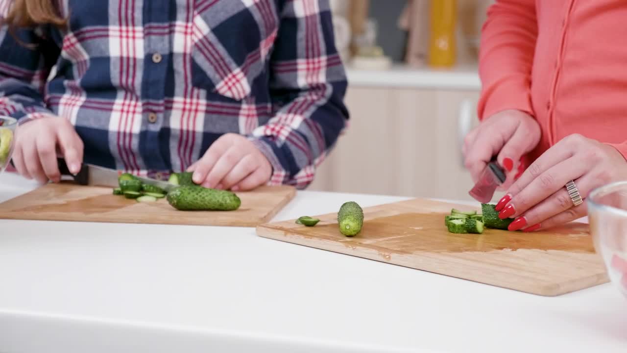 Stock Video Girl Helps Mom Chop Vegetables In Kitchen Live Wallpaper For PC - Free Download