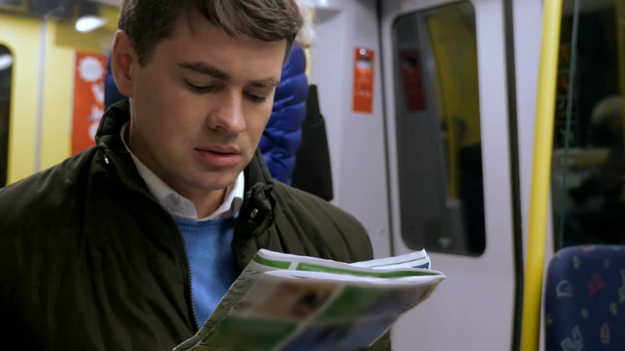 Video Stock Reading A Newspaper On The Train Live Wallpaper Free - Free Download
