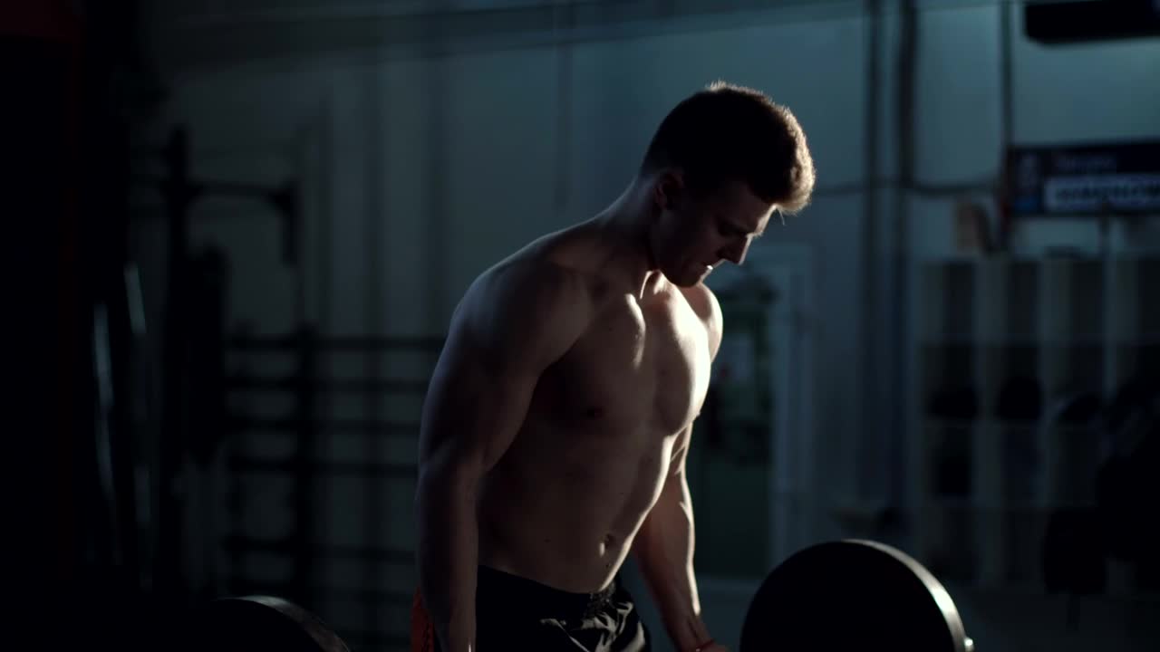 Stock Video Man Exercising With The Barbell At The Gym Animated Wallpaper - Free Download