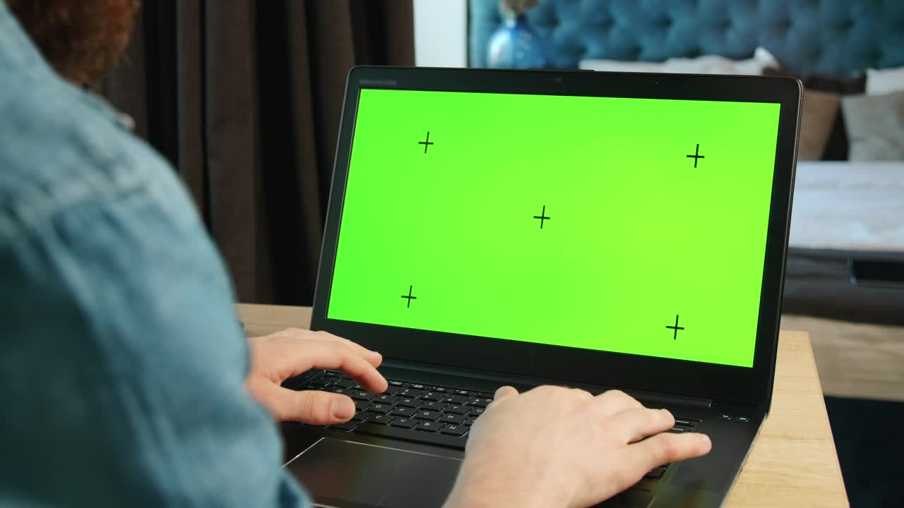 Stock Video Man Types On Greenscreen Laptop In Bedroo Animated Wallpaper - Free Download