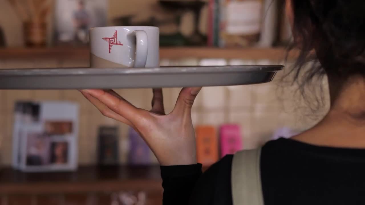 Stock Footage Waiter Carries A Cup Of Coffee To Customer Live Wallpaper - Free Download