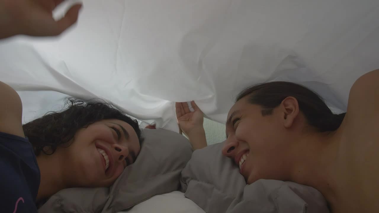 Stock Video Loving Couple Looking At Each Other Appreciatively In Bed Animated Wallpaper - Free Download