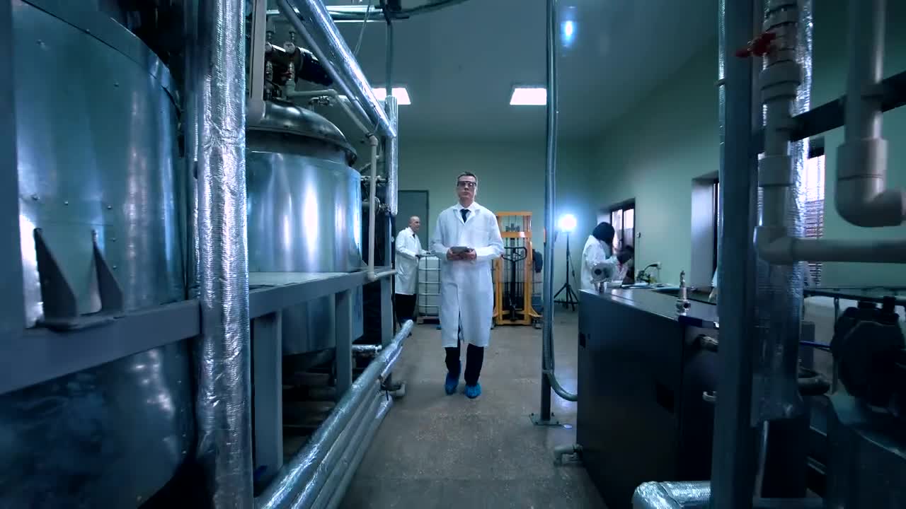 Free Stock Video Scientist Walking Through Laboratory Live Wallpaper - Free Download