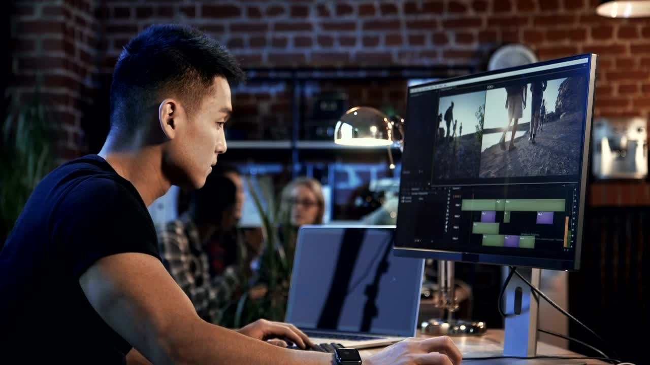 Stock Video Man Editing Video In The Computer Animated Wallpaper - Free Download