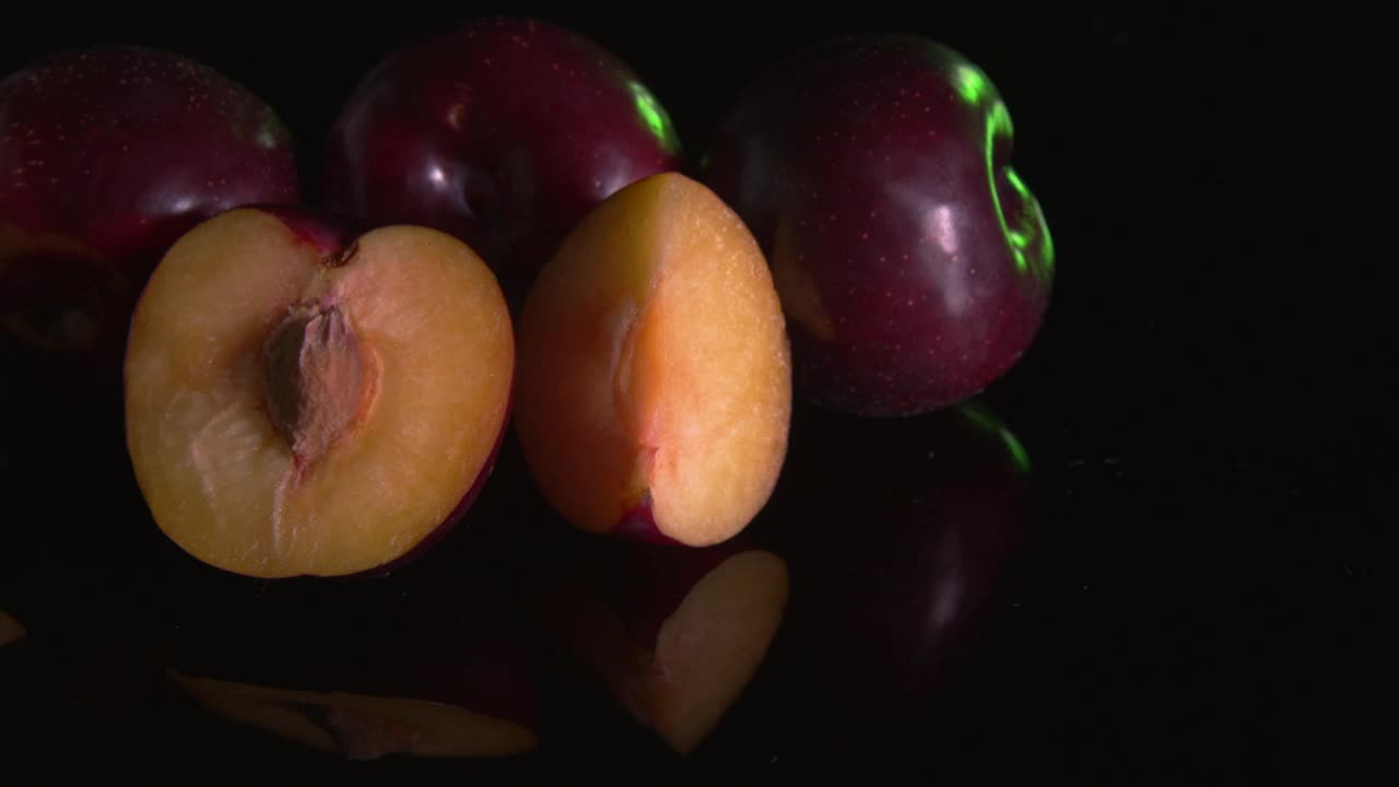 Free Video Stock Sliced Plums Against A Dark Background Live Wallpaper - Free Download