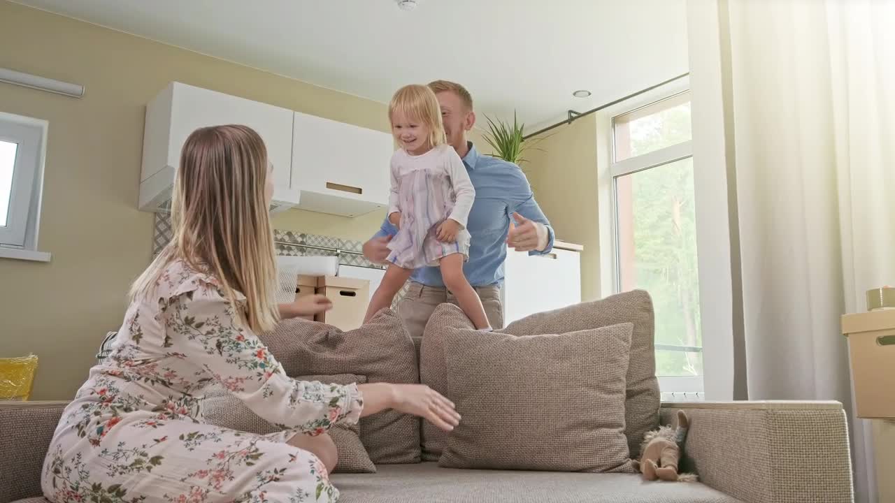 Stock Video Happy Parents Playing With Their Daughter Animated Wallpaper - Free Download