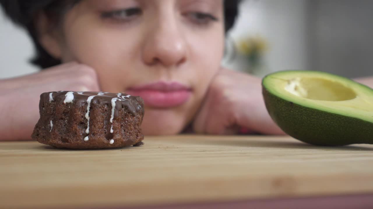 Stock Video Girl Making Difficult Choice Between Bad And Good Food Live Wallpaper For PC - Free Download