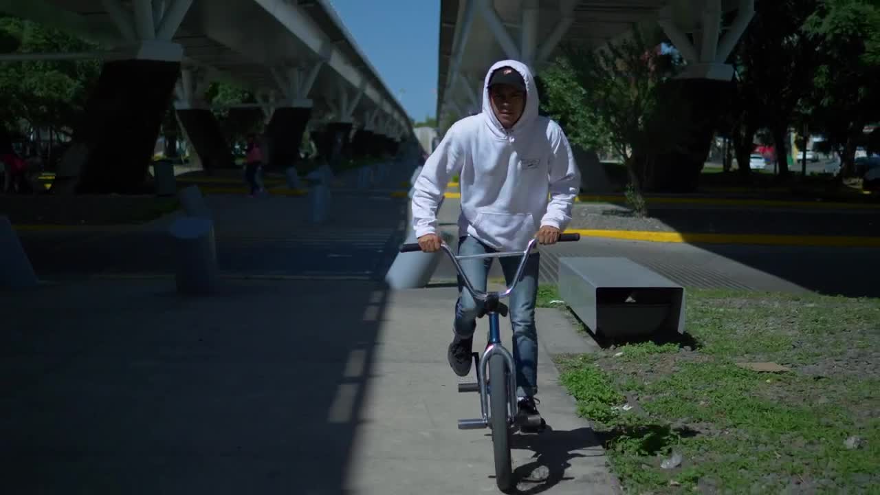 Stock Video Man Rides Bicycle Under Suspended Bridg Animated Wallpaper - Free Download