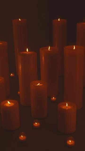 Free Stock Video Very Large And Very Small Candles Lit In The Dark Smalllive Wallpaper - Free Download