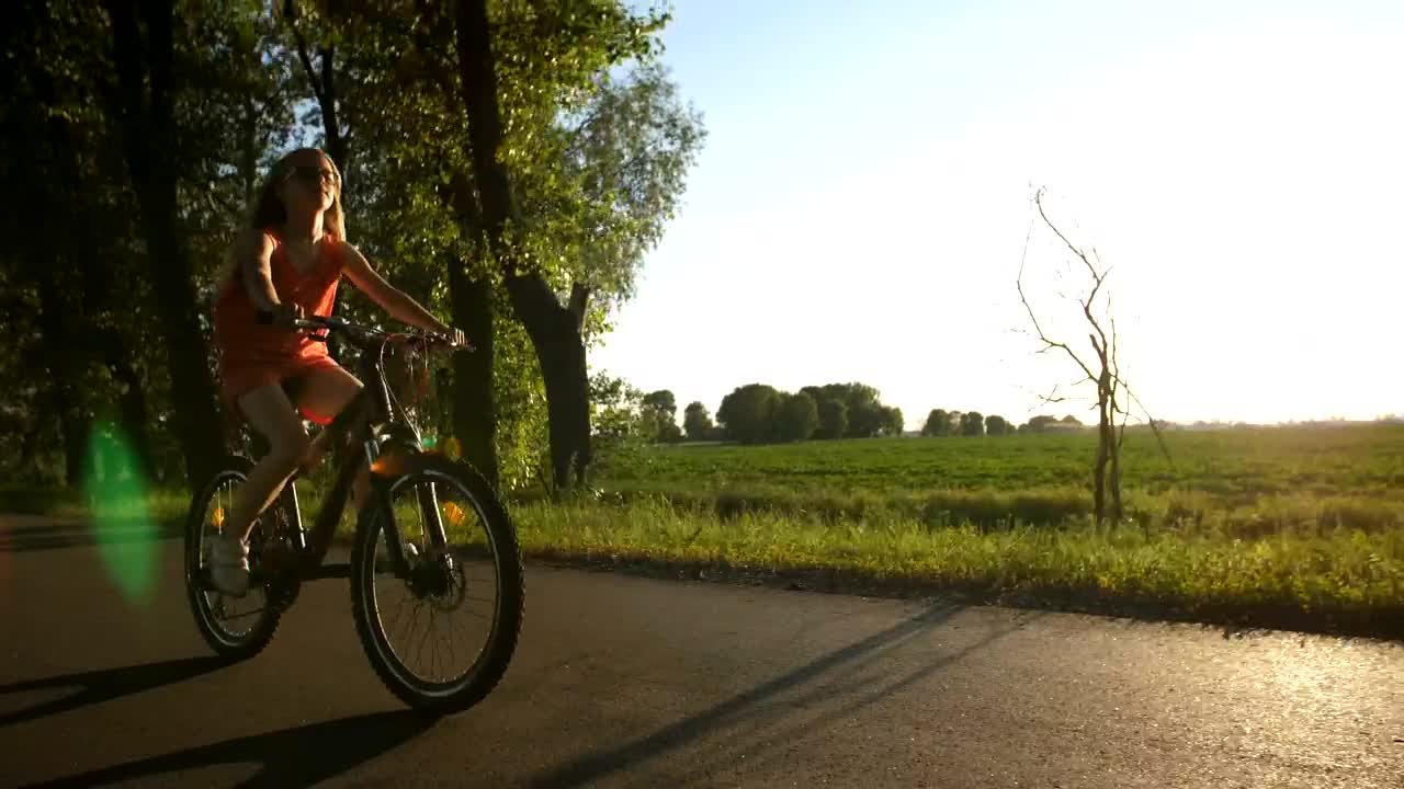 Stock Video Girl Riding A Bike On A Warm Evening Live Wallpaper For PC - Free Download