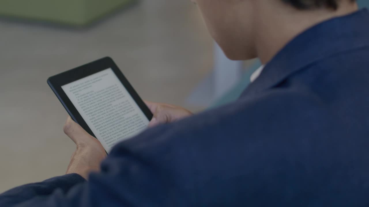 Stock Video Man Reading An Electronic Boo Animated Wallpaper - Free Download
