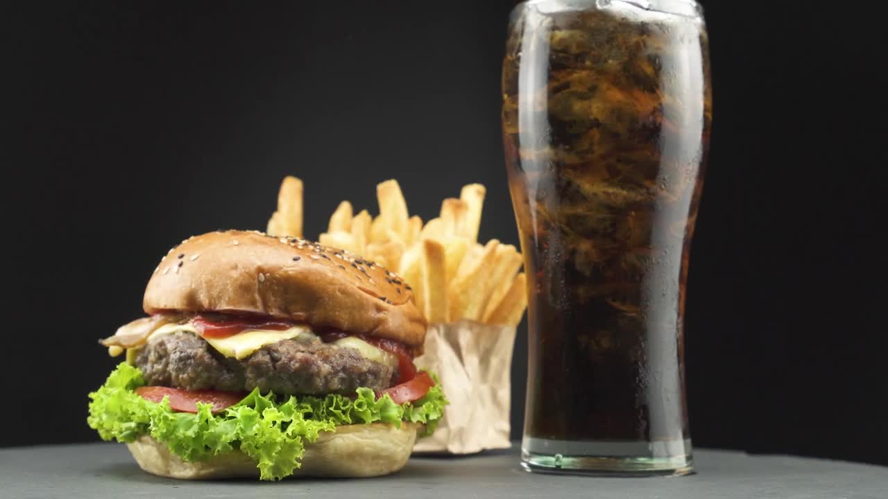 Stock Video Hamburger With Fries And A Soda On A Dark Background Live Wallpaper For PC - Free Download