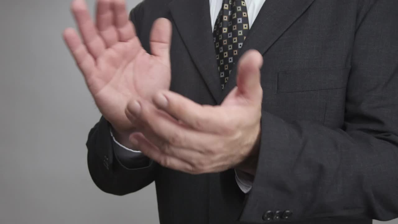Stock Video Man In A Suit Clapping Close Up Animated Wallpaper - Free Download