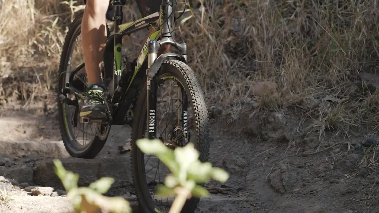 Stock Video Person Cycling Down A Rocky Slope Live Wallpaper - Free Download