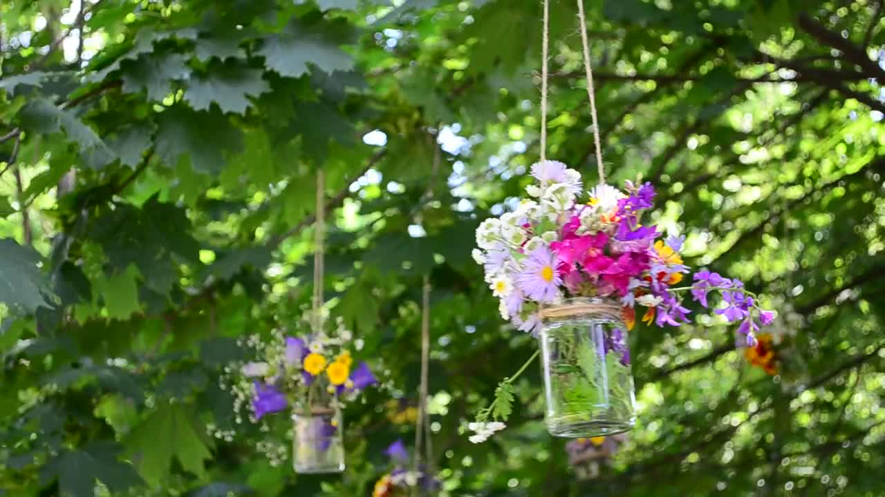 Stock Video Flowers In Glass Jars Hanging From A Tree Live Wallpaper For PC - Free Download
