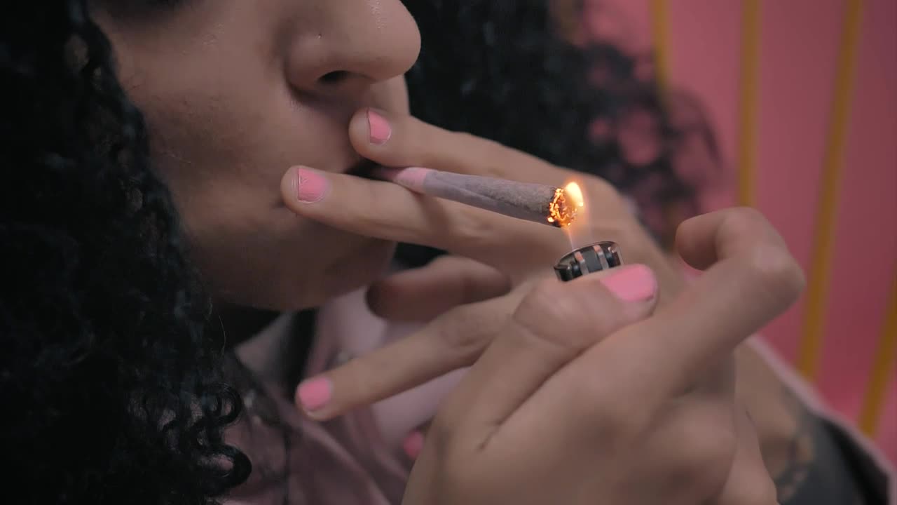 Free Stock Video Woman Lighting A Marijuana Cigarette Live Wallpaper - Free Download