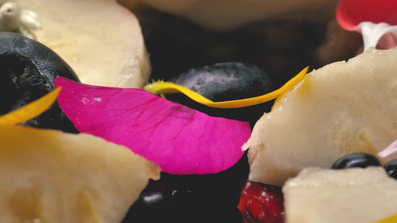 Video Stock Close Up Of Natural Fruit Pieces Decorated With Petals Live Wallpaper For PC - Free Download