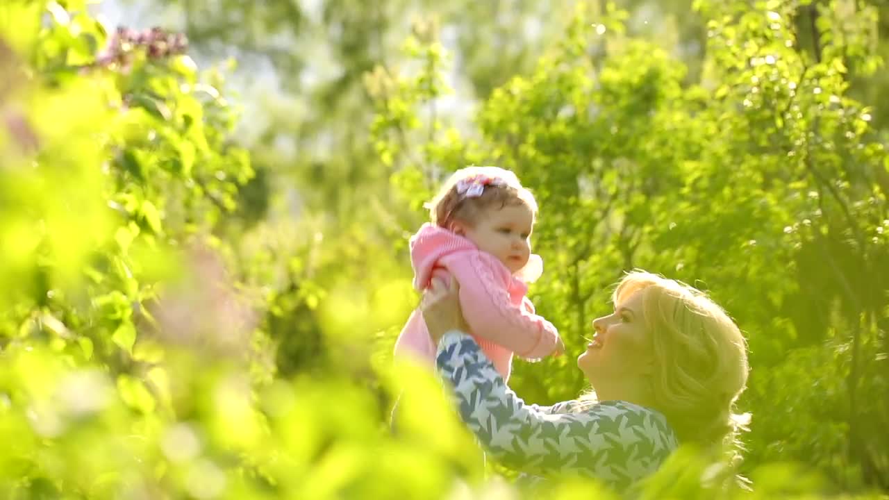 Stock Video Happy Woman Throws Her Daughter In The Air Animated Wallpaper - Free Download