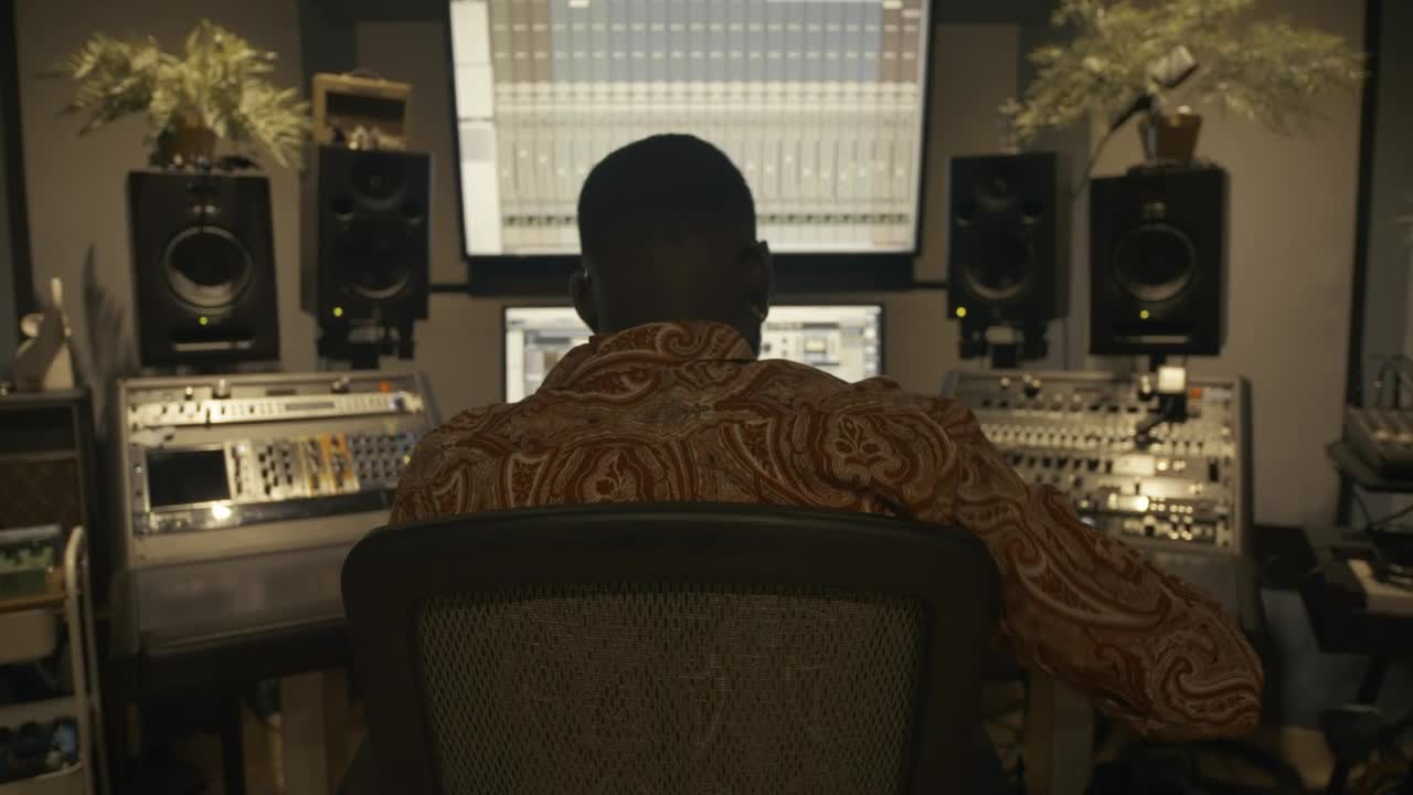 Stock Video Music Producer Dancing While Working In A Studio Live Wallpaper - Free Download