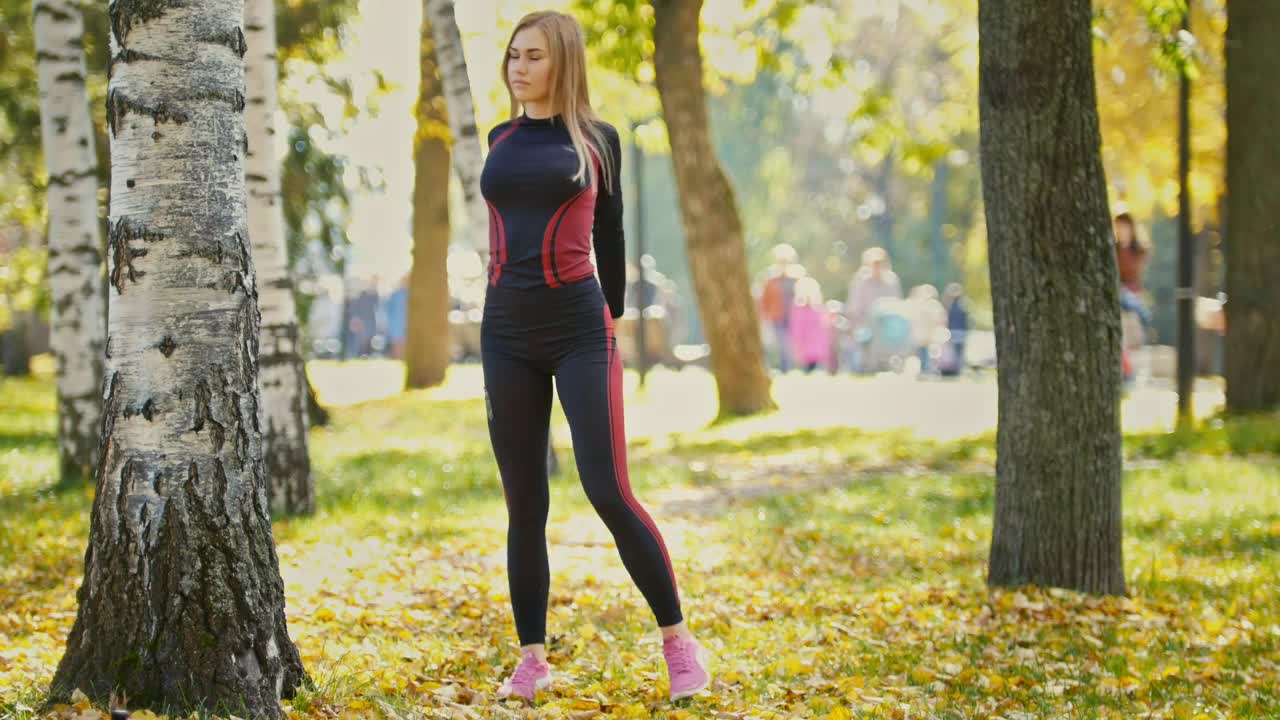 Stock Video Girl Stretching And Warming Up In A Sunny Park Live Wallpaper For PC - Free Download