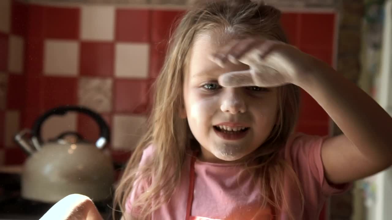 Stock Video Little Girl Playing With Flour On The Kitchen Animated Wallpaper - Free Download