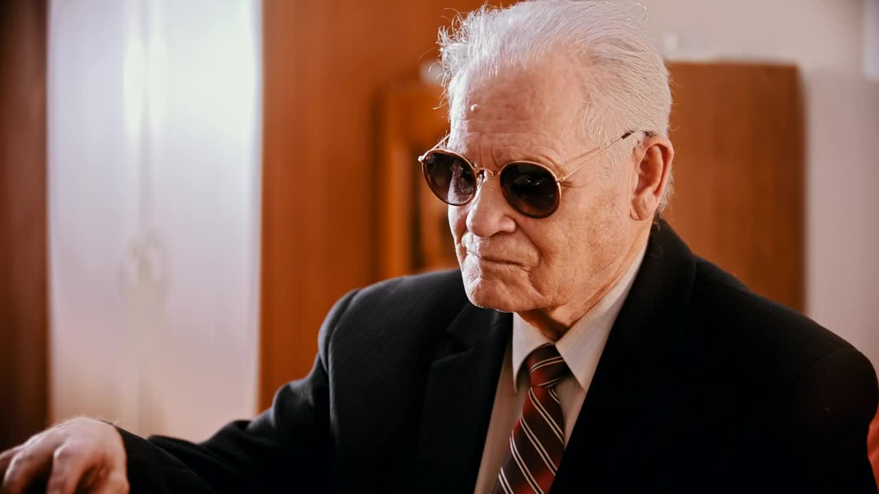 Stock Video Gangster With Sunglasses Preparing A Gun Live Wallpaper For PC - Free Download