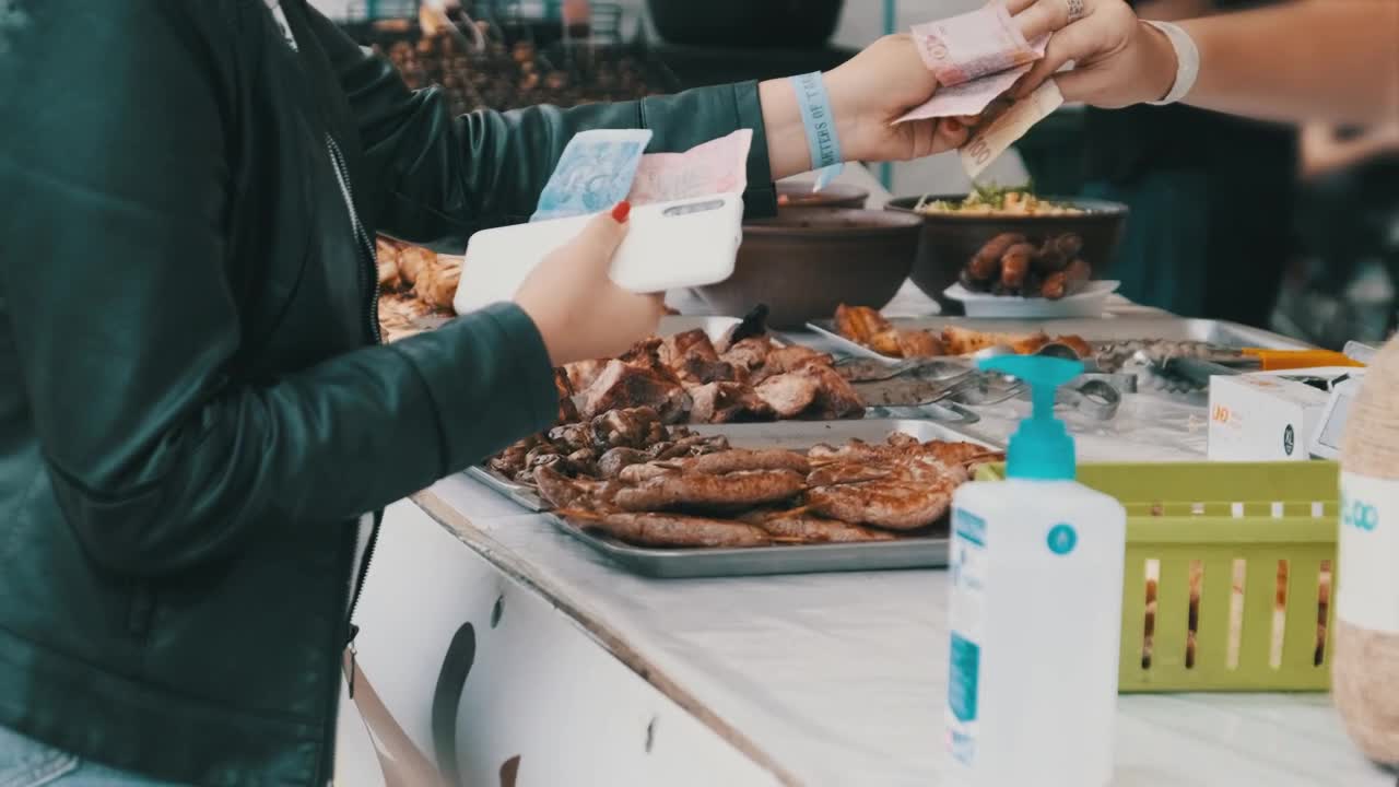 Stock Video Customer Buying Grilled Meat At The Market Live Wallpaper For PC - Free Download
