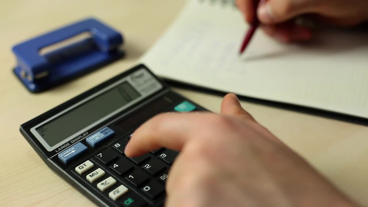 Free Video Stock Solving Accounts In A Notebook With A Calculator Live Wallpaper - Free Download