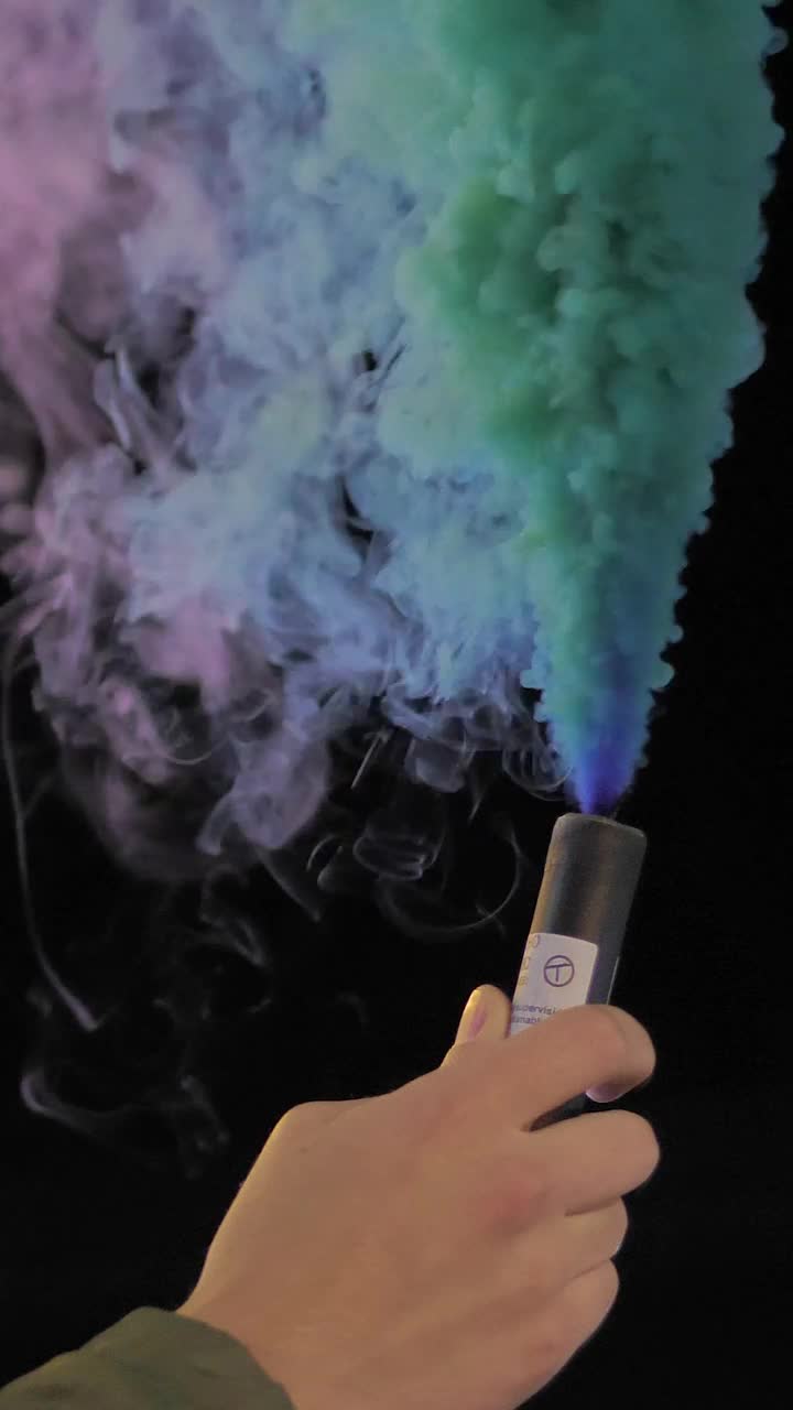 Stock Video Hand Holding A Multicolored Smoke Bomb Live Wallpaper For PC - Free Download