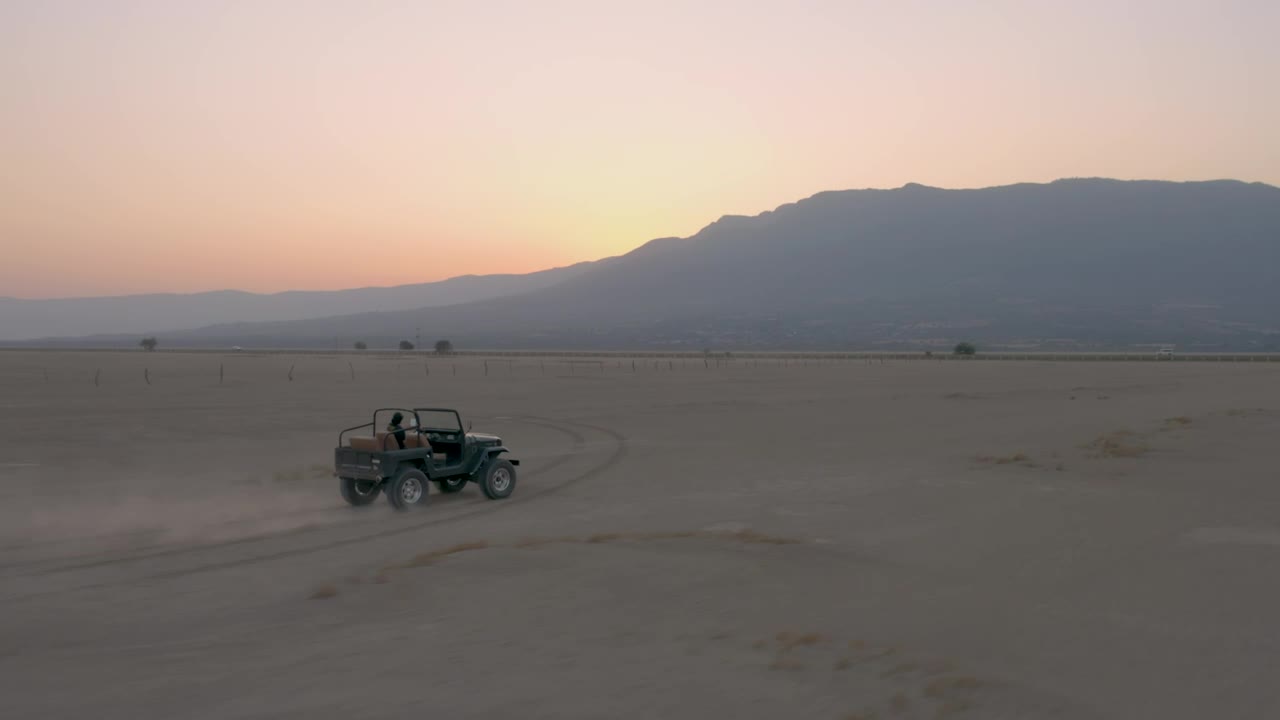 Stock Video Man Driving A Jeep Crossing A Desert Animated Wallpaper - Free Download