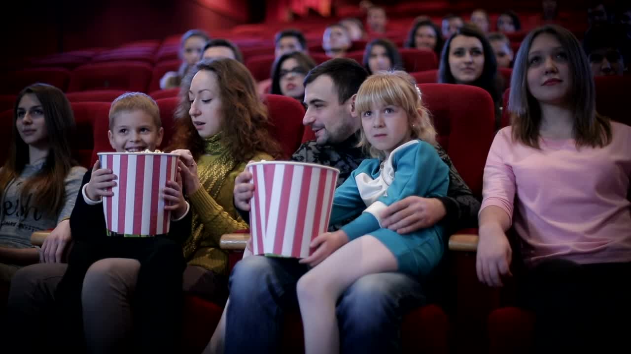 Stock Video Family Enjoying A Movie At The Cinema Medium Shot Live Wallpaper For PC - Free Download