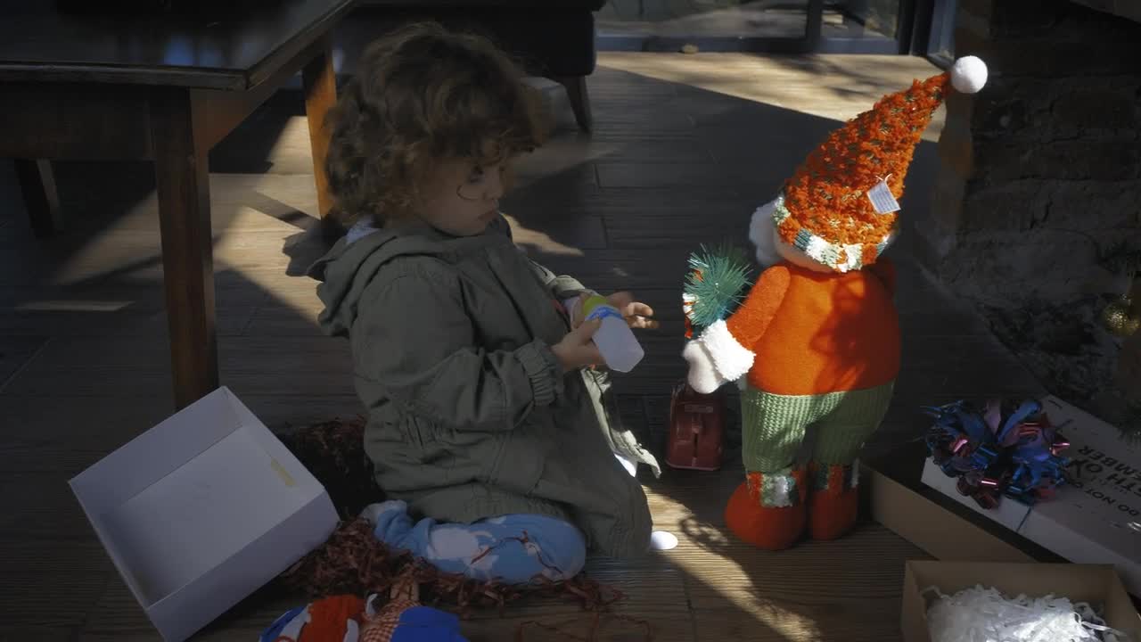 Stock Video Little Girl Playing With Gifts On Christmas Morning Animated Wallpaper - Free Download