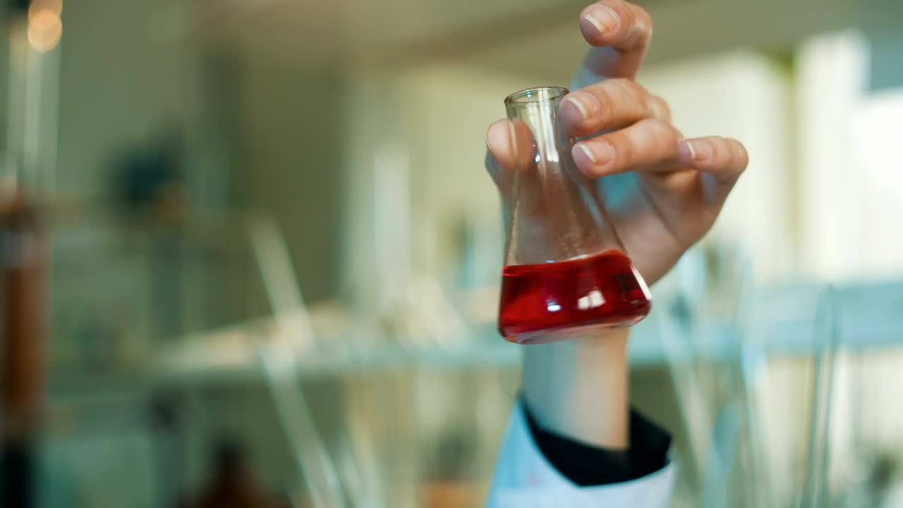 Free Stock Video Scientist Shaking A Conical Flask In The Laboratory Live Wallpaper - Free Download