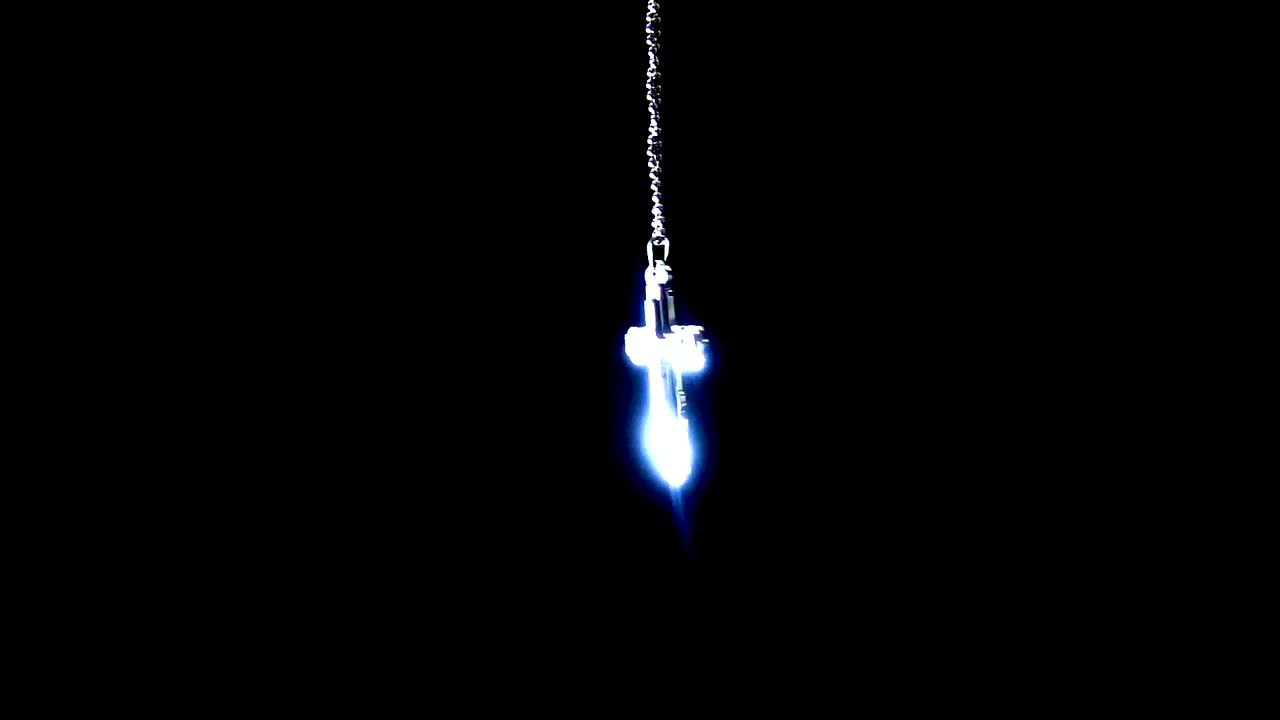 Free Stock Video Silver Crucifix Necklace On Black Background Live Wallpaper - Free Download