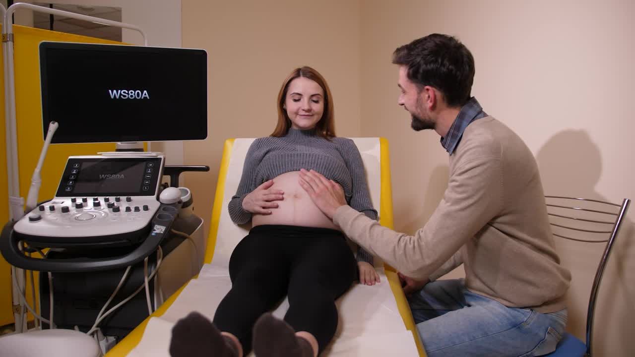Stock Video Husband Kissing His Pregnant Wife Animated Wallpaper - Free Download