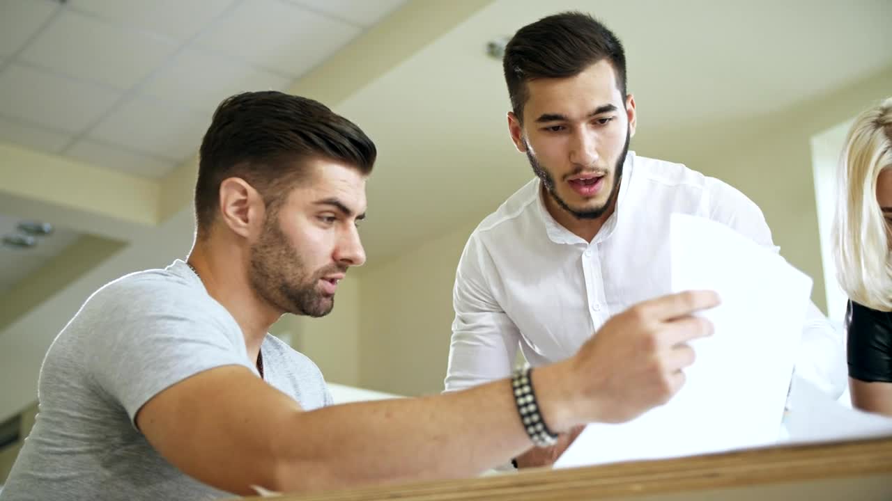 Stock Video Co Workers Reviewing A Document Live Wallpaper For PC - Free Download