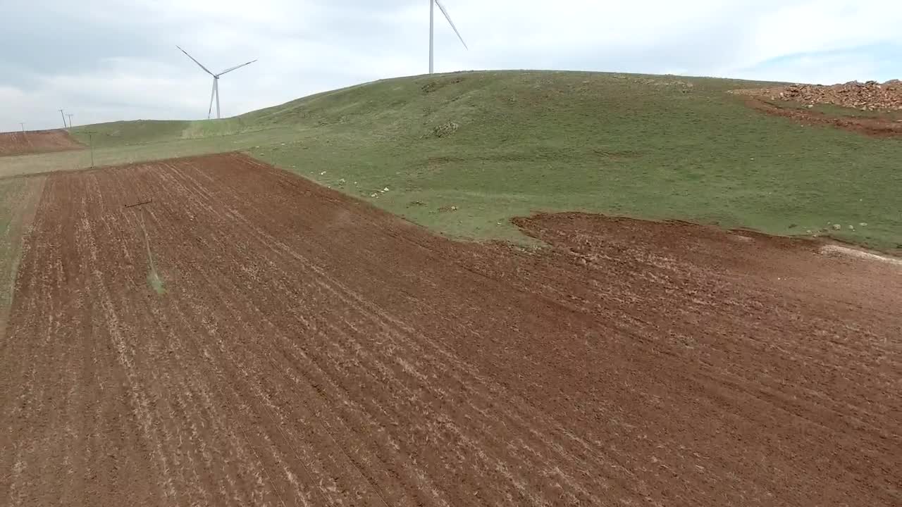 Stock Footage Wind Turbines In A Vast Green Plain Live Wallpaper - Free Download