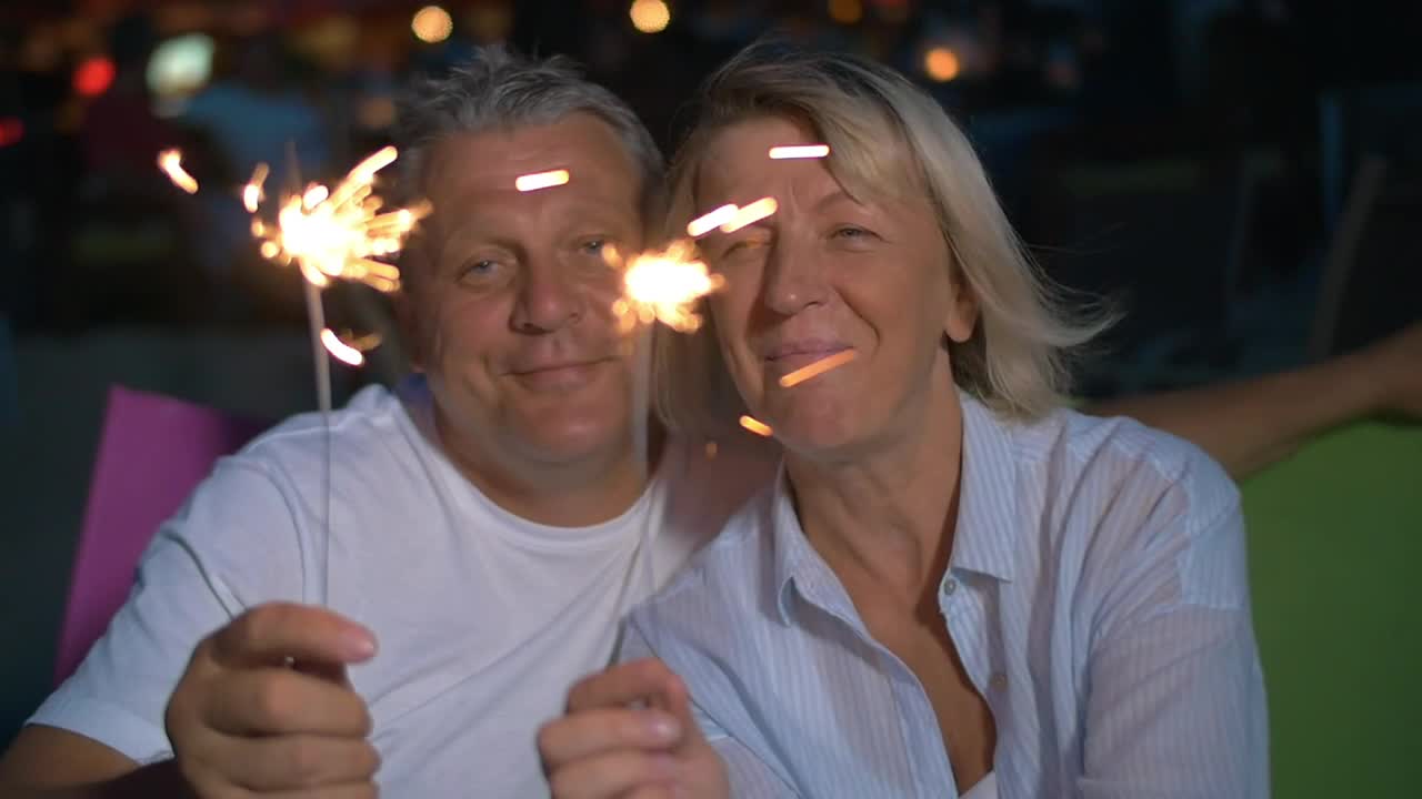 Stock Video Couple Smiling With Sparklers Live Wallpaper For PC - Free Download