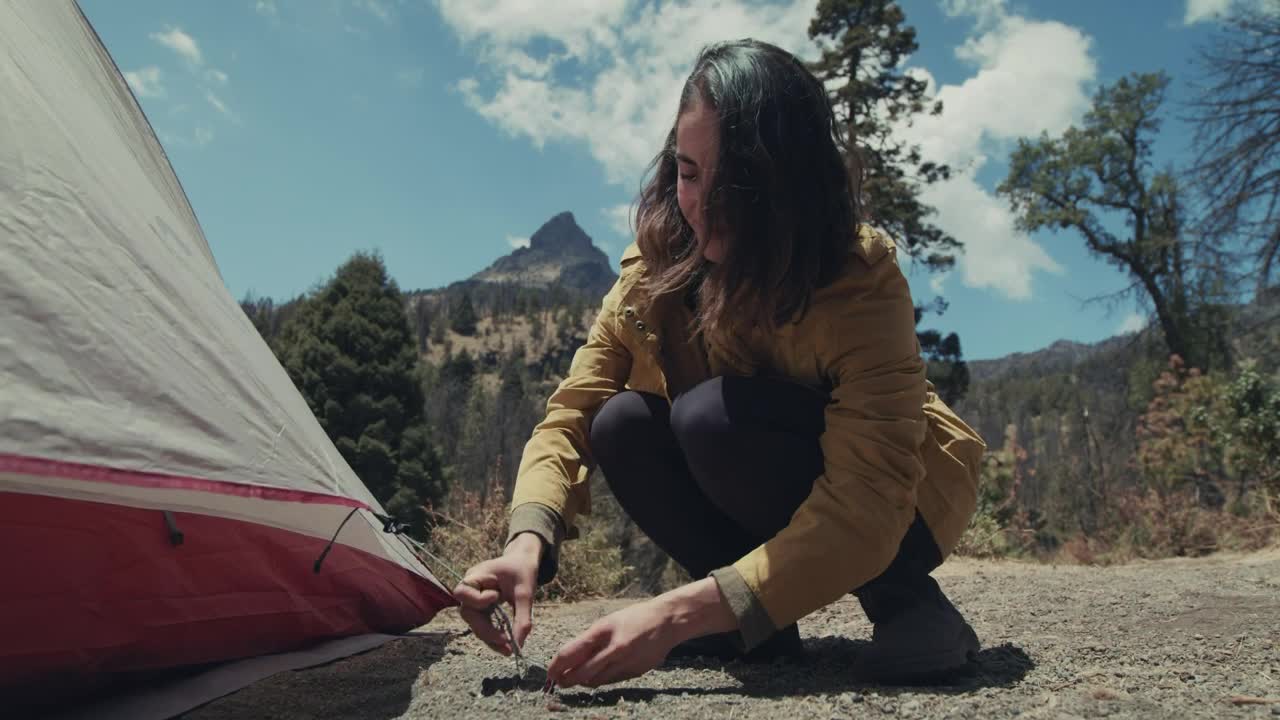 Free Stock Video Woman Tying Her Tent To A Nail Live Wallpaper - Free Download