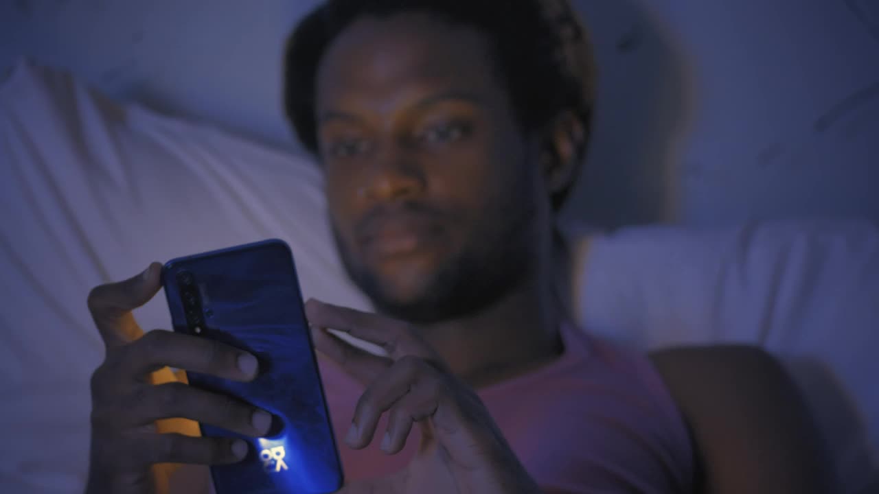 Free Stock Video Young Man Lying On His Bed Checking His Smartphone Live Wallpaper - Free Download
