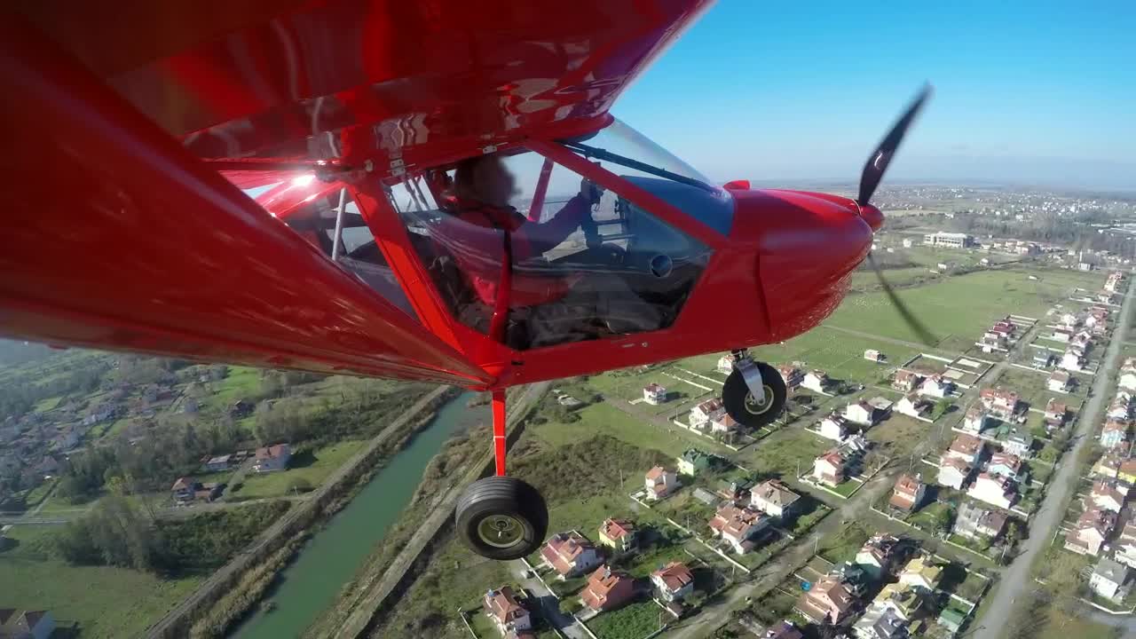 Video Stock Red Aircraft Flying Above The Houses And Landing Live Wallpaper Free - Free Download