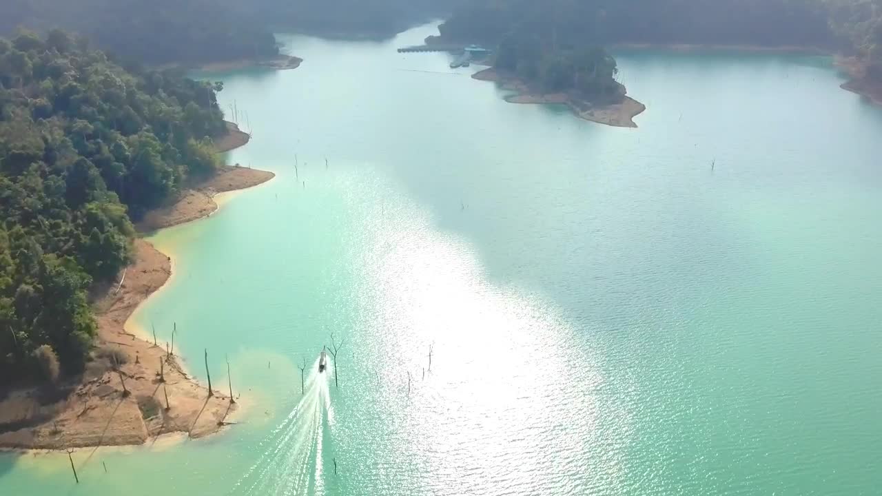 Stock Video Motorboat Sailing In A Bay On A Sunny Day Live Wallpaper - Free Download