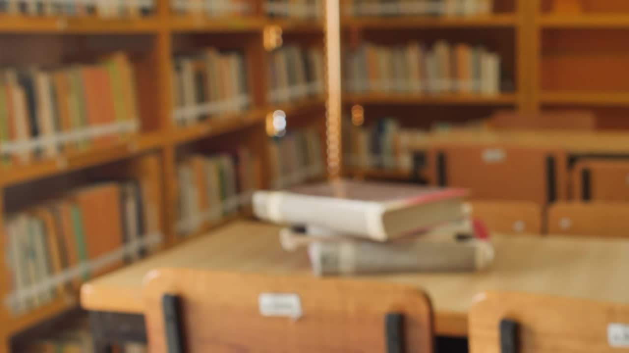 Stock Video Focus On A Stack Of Books In A Library Live Wallpaper For PC - Free Download